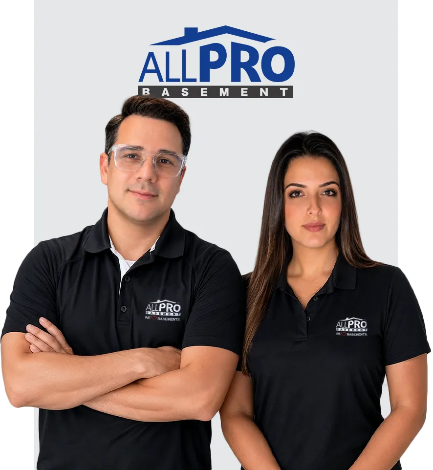 Diego Tameirao and Keila Tameirao, owners of All Pro Basement Waterproofing, standing together in branded company shirts. Diego oversees waterproofing operations, while Keila manages basement remodeling projects across Massachusetts.